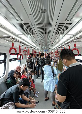 Jakarta, Indonesia - June 17, 2019: Passengers On The Train Of Lrt Jakarta At Kelapa Gading Boulevar