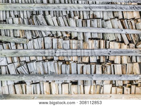Background Of Splitted, Dried And Stacked Firewood. Bunch Of Wood.