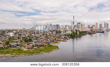 Slums Of Poor People On The Background Of A Big City. The City Of Manila, Poor And Poor Areas. Contr