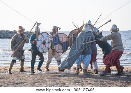 Slavic Warriors Reenactors With Wearpons And Shields Training Fighting Outdoors At Seaside
