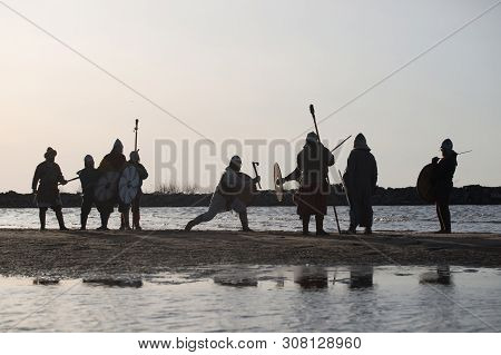 Slavic Warriors Reenactors With Wearpons And Shields Training Fighting Outdoors At Seaside