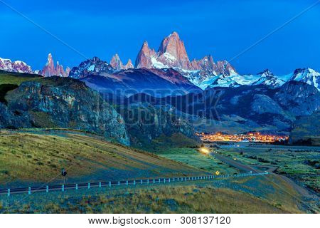 Early morning in the village of El-Chalten. Mountain peak in Patagonia. The grand crimson dawn over the mountain range Fitzroy. The concept of extreme, active and photo tourism