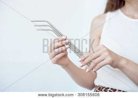 Girl Is Holding Stainless Steel Straws To Reduce The Amount Of Plastic Waste In The Environmen.