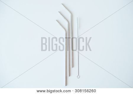 Lot Of Metal Tubes For Cocktails With Schutkoy For Cleaning Isolated On White.