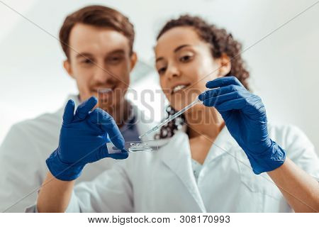 Selective Focus Of A Microscope Slide With Liquid
