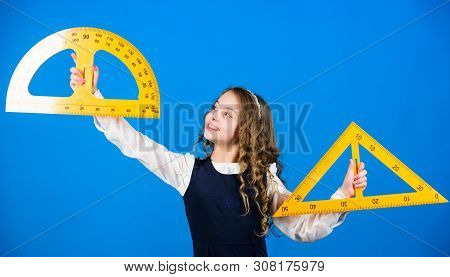 Stem School Disciplines. School Student Learning Geometry. Pupil Girl With Big Rulers. Small Girl Ba