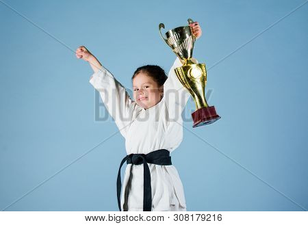 Sport Success. Training To Be The Best. Small Girl With Champion Cup. Martial Arts. Practicing Kung 
