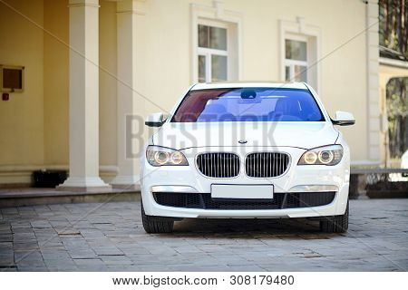 Grodno, Belarus, May 16, 2013: Modern Luxury Bmw 750li Xdrive Car Front View Parked On Stone Paved P