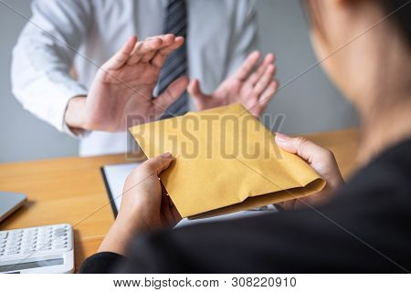 Anti Bribery And Corruption Concept, Business Man Refusing And Don't Receive Money Banknote In Envel