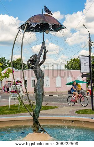 Borovsk, Russia - June 2019: Fountain With A Sculpture Of A Girl With An Umbrella 