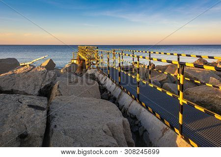 A Metal Bridge On The North Breakwater Overlooking The Gulf Of Gdansk Near The Beach At Westerplatte