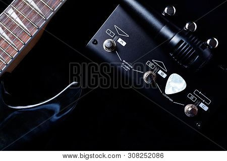 Multieffects Processor For Electric Guitar And A Microphone On Black Background. Top View.