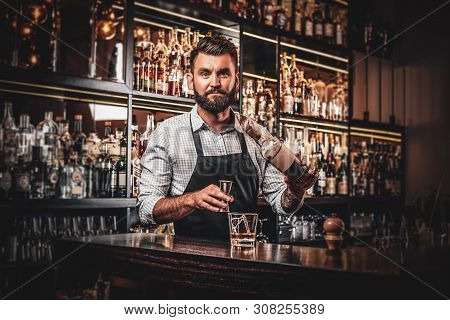 Cheerful Barman Is Making Beverage For Customers At Cozy Restauraunt.