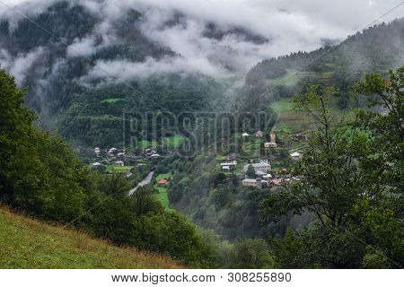 Georgian Landscape Of Svaneti Mountains With Small Village And Svan Towers