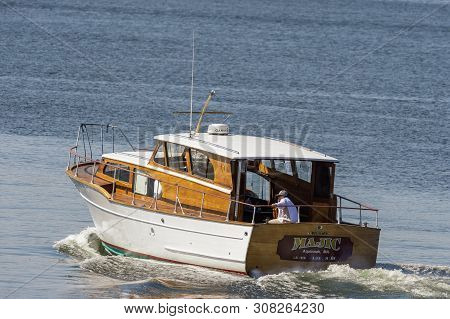 New Bedford, Massachusetts, Usa - June 24, 2019: Classically Styled Cabin Cruiser Majic Sets Out Fro