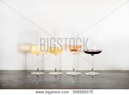 Variety Of Wine Types Over Concrete Table, Copy Space