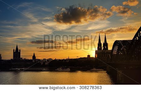 Amazing Sunset View On Cologne Cathedral And Hohenzollern Bridge In Koel, Germany. Tourism And Trave