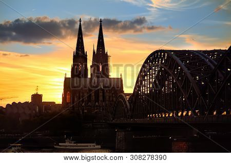 Amazing Sunset View On Cologne Cathedral And Hohenzollern Bridge In Koel, Germany. Tourism And Trave