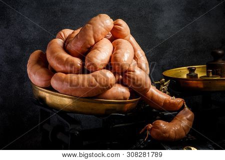 Big Bunch Of Raw Short Thick Wieners Rolled In Spiral On Scales