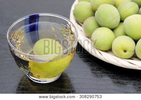 Japanese Plum Wine Called Umeshu On Black Background