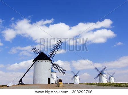 Famous Old Spanish Windmills Against Blue Cloudy Sky Outdoors. Campo De Criptana, Castilla La Mancha