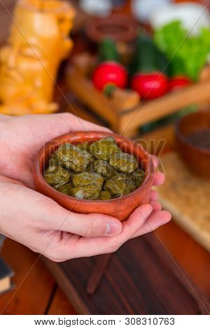 Yarpag Dolmasi, Yaprak Sarmasi, Green Grape Leaves Stuffed With Rice And Meat In Pottery Bowl Hold I