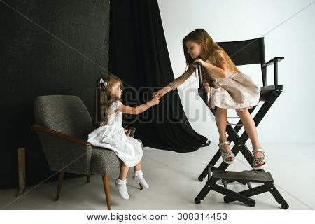 Interaction Of Children With Adult World. Cute Girls Trying To Do Bright Make Up For Being Older. Li
