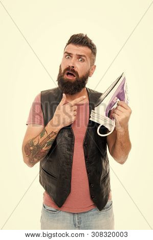 Man Bearded Hipster Hold Electric Ironing Tool. How Iron Clothes Correctly. Guy With Iron On White B