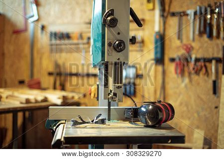 detail of carpenter tool bandsaw in workshop