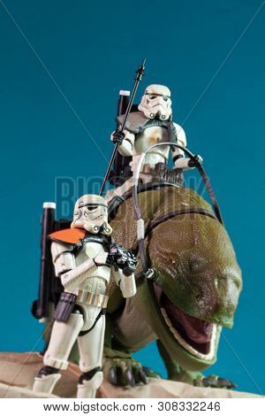 JUNE 1 2018: Recreation of a scene from Star Wars showing Sandtroopers and Dewback in the deserts of Tatooine, searching for the droids with the stolen Deathstar plans - Hasbro action figures