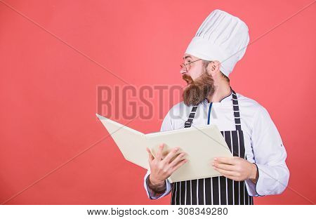 Book Recipes. According To Recipe. Man Bearded Chef Cooking Food. Culinary Arts Concept. Amateur Coo