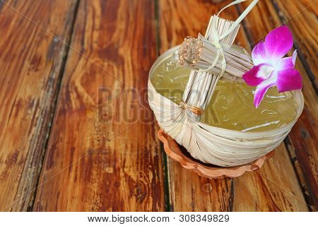 Thai Eastern Style Sweet And Sour Cold Calamansi Citrus Juice Served On Wooden Table