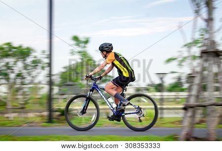 Bangkok, Thailand - June 24: Unnamed Cyclist Rides Bicycle On Bike Path In Bang Khae Phirom Park In 