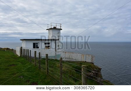 White Coastguard Station On Fleswick Bay In West Cumbria England.