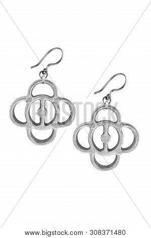 Pair Of Stylish Metallic Earrings Isolatede Over White