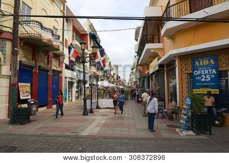 Santo Domingo, Dominican Republic - November 08, 2012: People Walk By The Pedestrian Shopping Street