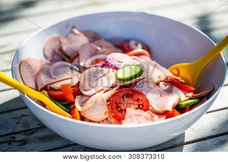 Sausage Salad With Cucumbers, Tomatoes And Onions