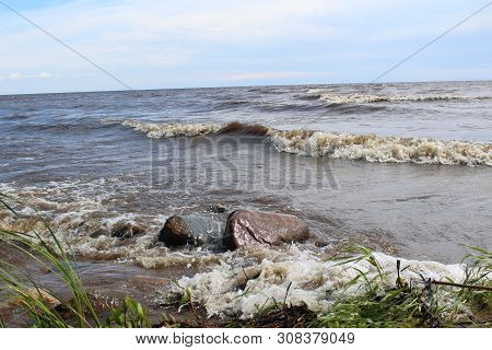 Picturesque, Large Lake With Waves And Shore