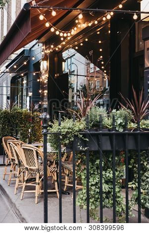 London, Uk - June 5, 2019: Exterior Of A Restaurant Decorated With Lights In Fitzrovia, Diverse Area