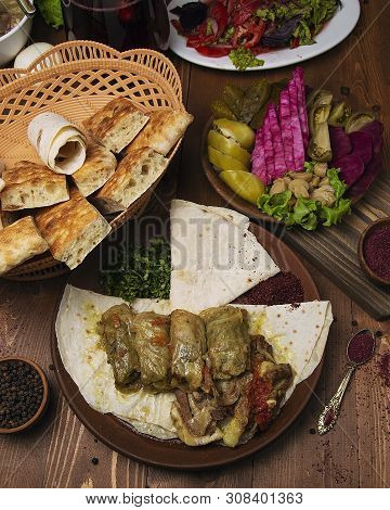 Kelem Dolmasi, Cabbage Leaves Stuffed With Meat And Rice, With Beef Stew With Vegetables In Lavash. 