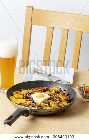 Tyrolean Potato Groestl With Onions On A Table