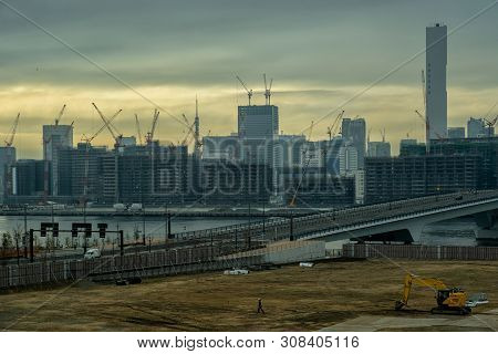 Scene Of Building And Bridge Cityscape Under Construction In Twilight Time Around Odaiba Area, Tokyo