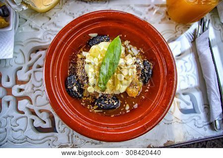 Traditional Moroccan Tajin Dish. This Is Meat And Some Vegatebles Or Fruits. This Typical Food Is Co