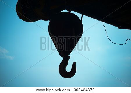 Electric Windlass With Hook For Lifting Large Loads. Against The Sky