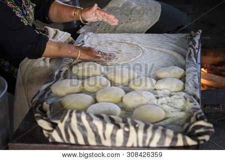 Close Up Of Old Arab Woman Hands Kneading Fresh Dough For Taboon Bread Or Lafah Is A Middle Eastern 