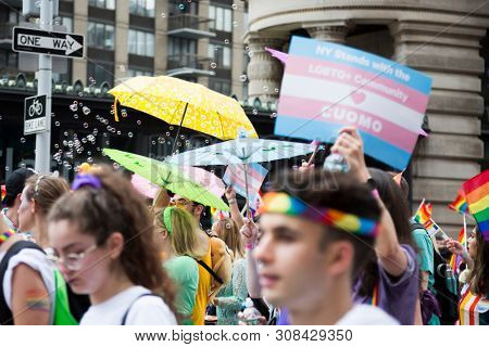 2018 JUNE 24 NEW YORK: Supporters of Democratic New York Governor Andrew Cuomo march along the 5th Ave parade route during the NYC Pride March.