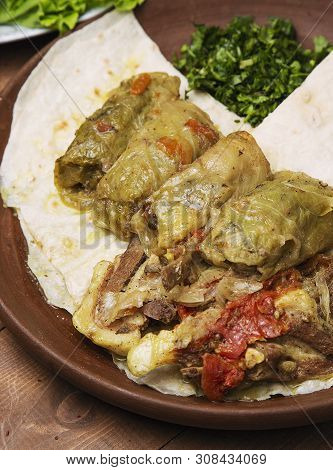 Kelem Dolmasi, Cabbage Leaves Stuffed With Meat And Rice, With Beef Stew With Vegetables In Lavash. 