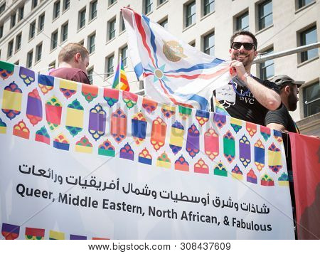2018 JUNE 24 NEW YORK: NYC Pride March participants ride on the Tarab NYC float, a non-profit inclusive organization for Arab, Middle Eastern, and North African people, MENA, on 5th Ave.