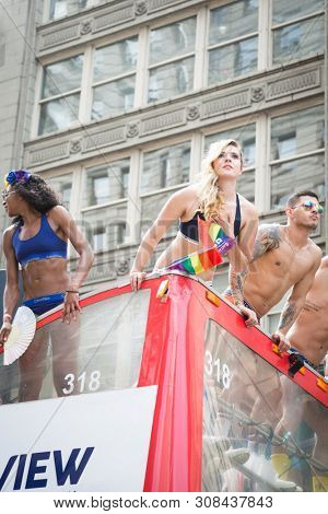 2018 JUNE 24 NEW YORK: NYC Pride March participants wearing only company brand underwear ride on the PVH parade float on 5th Ave route. Phillips-Van Heusen Corporation is an American clothing company.