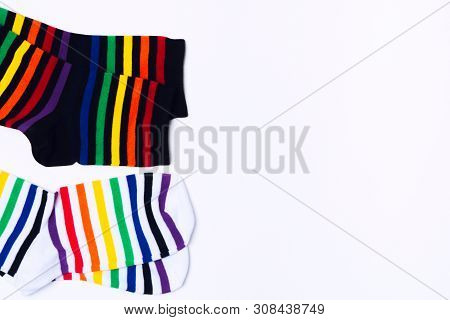 Two White And Black Pair Of Socks With Colorful Striped Pattern For Feet. Fashionable Clean Cotton C